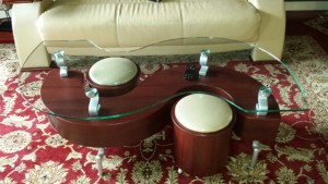S shaped cherry finished glass coffee table