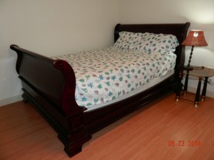 Wooden bed frame with brand new queen-sized mattress