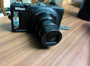 Nikon S9300 with memory card and pouch